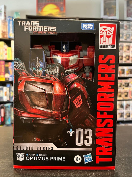 TRA GEN STUDIO VOY WFC GAMER ED OPTIMUS PRIME ACTION FIGURE